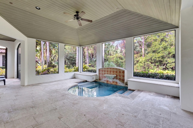 interior space with a jacuzzi, ceiling fan, lofted ceiling, and wood ceiling