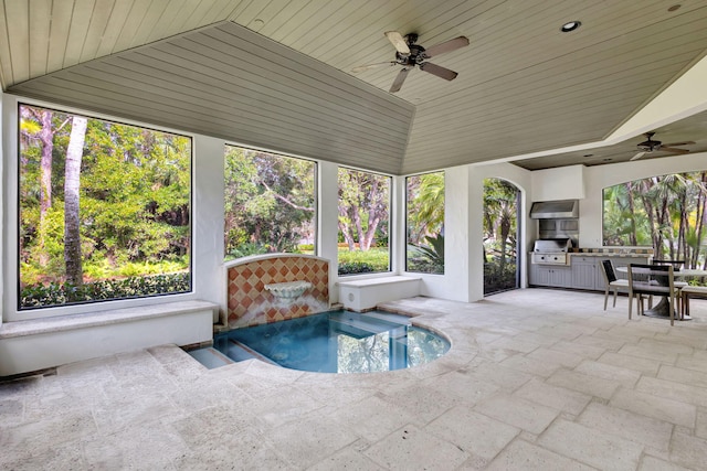 interior space with ceiling fan, wood ceiling, a jacuzzi, and lofted ceiling