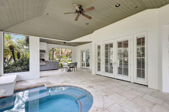 view of pool with a patio area, ceiling fan, french doors, and a hot tub