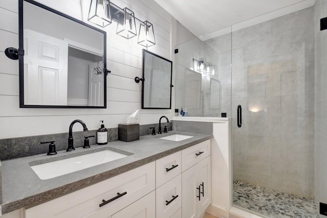 bathroom featuring vanity and an enclosed shower