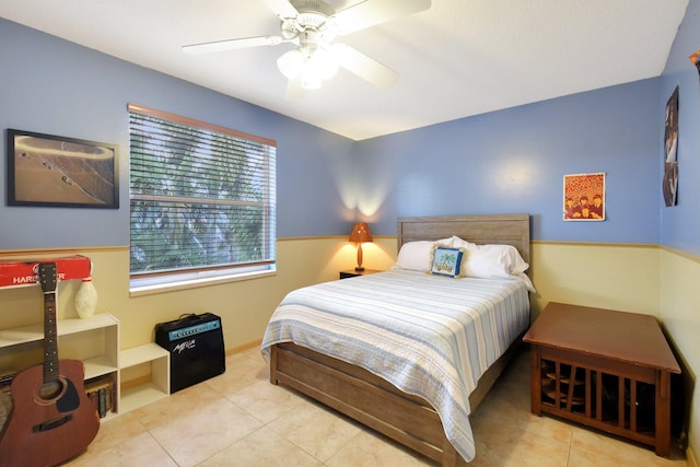 tiled bedroom with ceiling fan