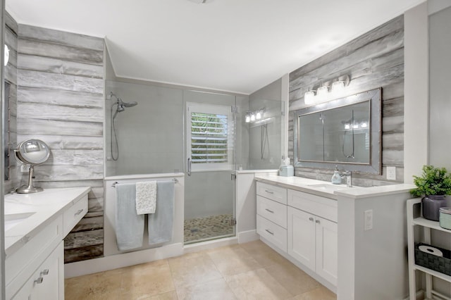 bathroom featuring vanity and an enclosed shower