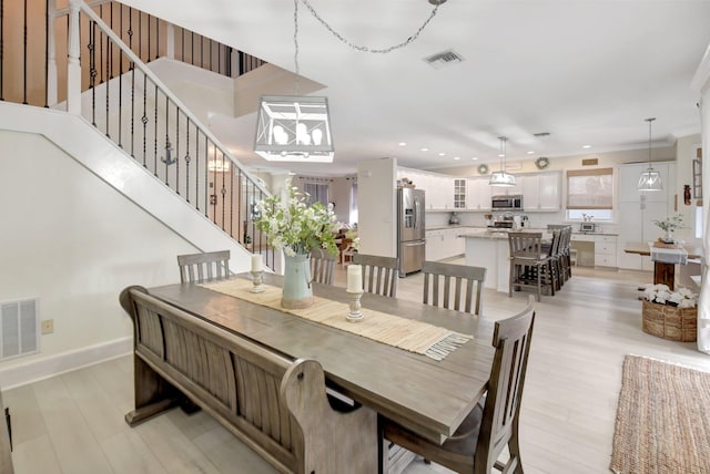 dining room with light hardwood / wood-style floors