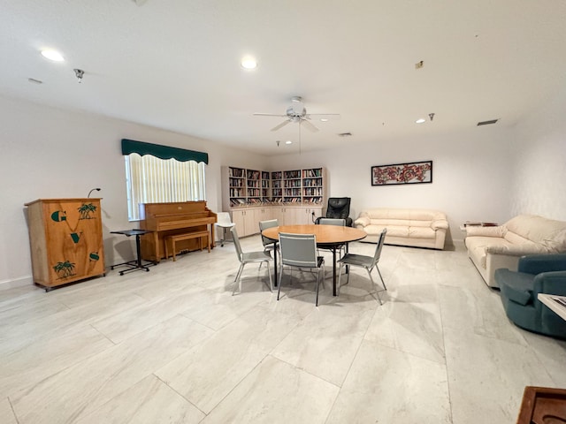 dining space with ceiling fan