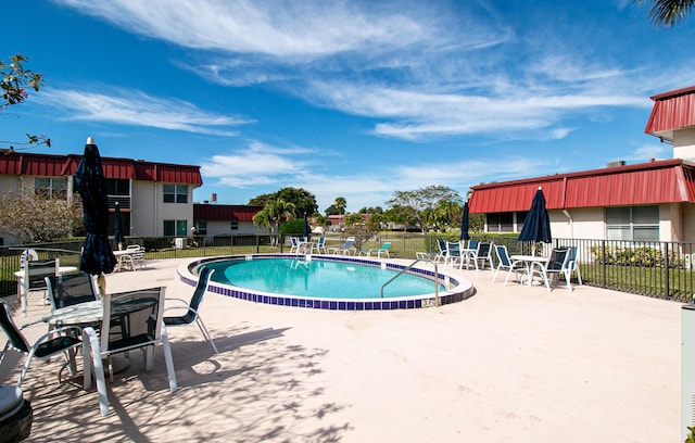 view of pool featuring a patio