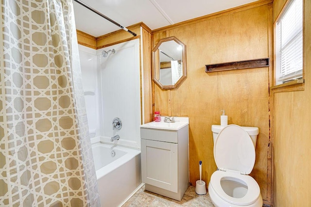 full bathroom with vanity, wood walls, toilet, and shower / tub combo with curtain