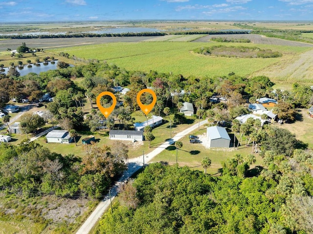 bird's eye view with a rural view and a water view