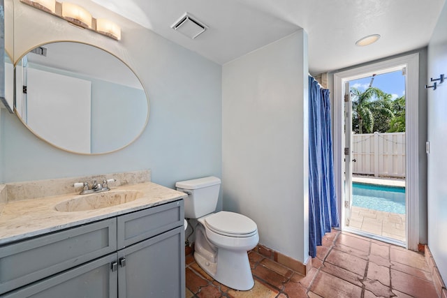 bathroom featuring vanity and toilet