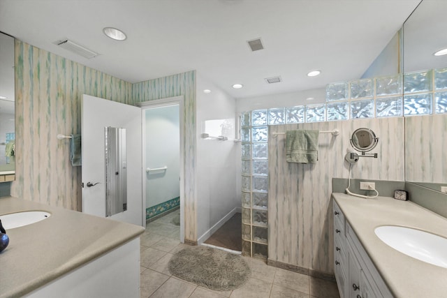 bathroom featuring a shower, tile patterned floors, and vanity