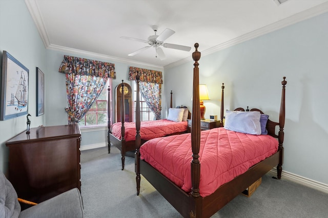 carpeted bedroom featuring ceiling fan and crown molding