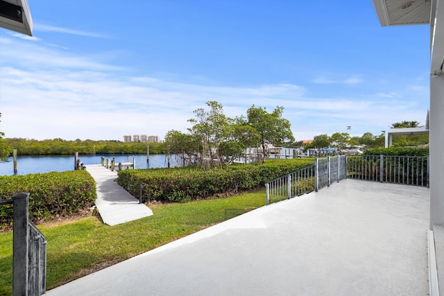 view of patio featuring a dock and a water view