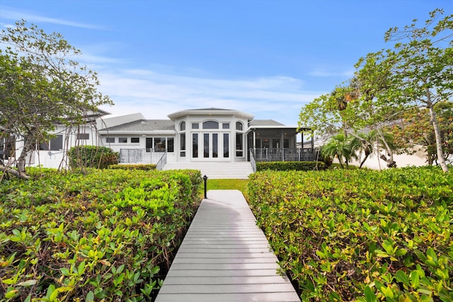 rear view of house with a sunroom