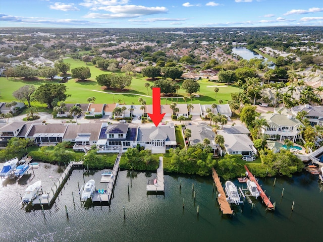 birds eye view of property with a water view