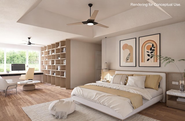 bedroom featuring ceiling fan, hardwood / wood-style floors, and a tray ceiling