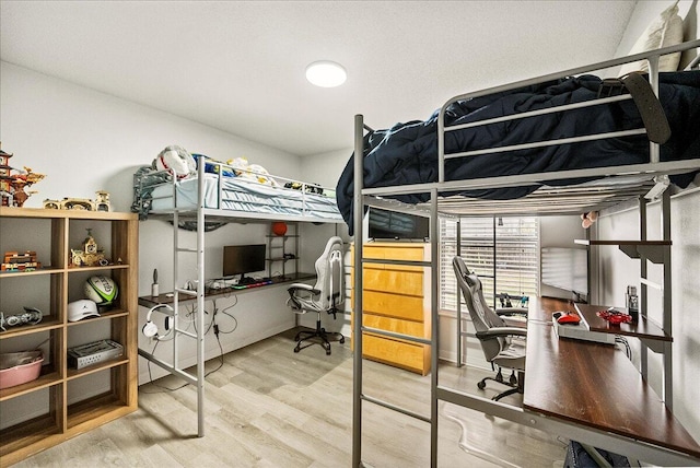 bedroom with wood-type flooring