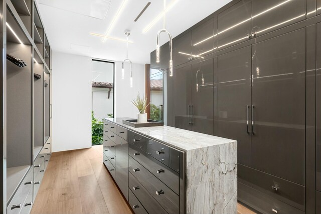 bathroom featuring an enclosed shower, vanity, and toilet