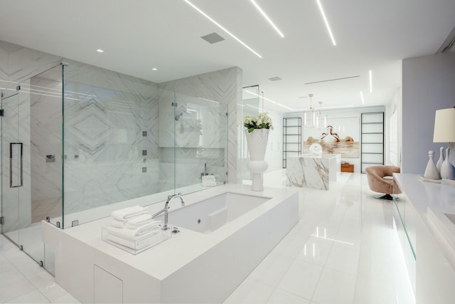 bathroom with tile patterned flooring, vanity, and independent shower and bath