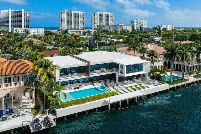 birds eye view of property with a water view