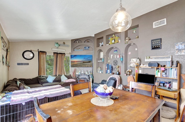 dining space with lofted ceiling