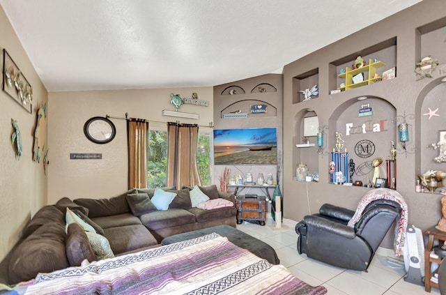 living room with lofted ceiling, light tile patterned floors, and a textured ceiling