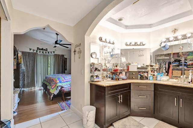 bathroom with tile patterned floors, ceiling fan, and vanity