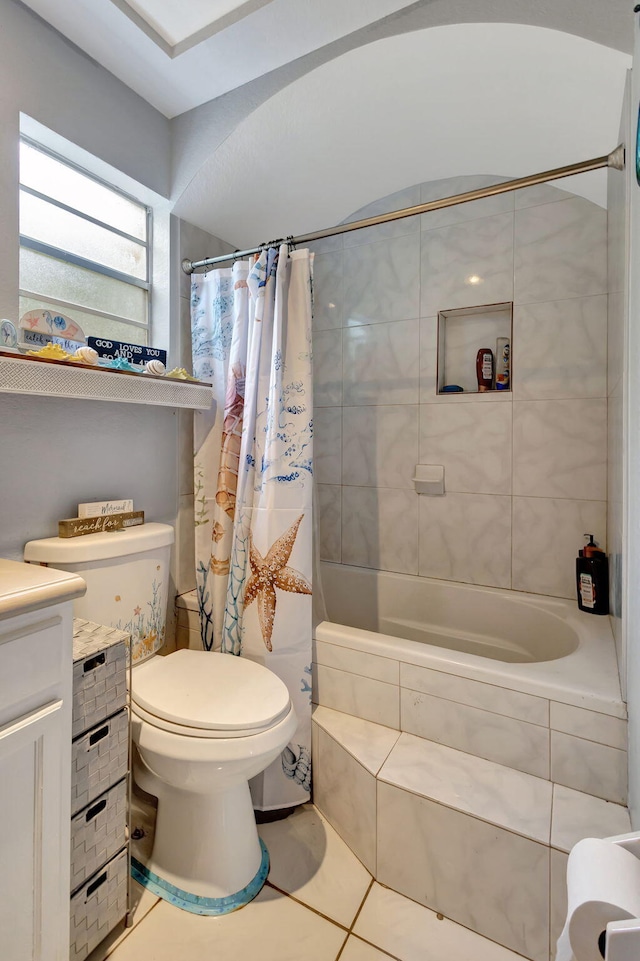 full bathroom featuring tile patterned flooring, shower / tub combo, vanity, and toilet