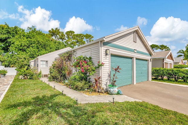 garage featuring a yard