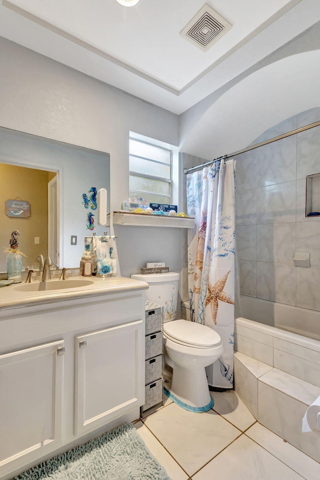 full bathroom featuring tile patterned flooring, vanity, shower / tub combo, and toilet