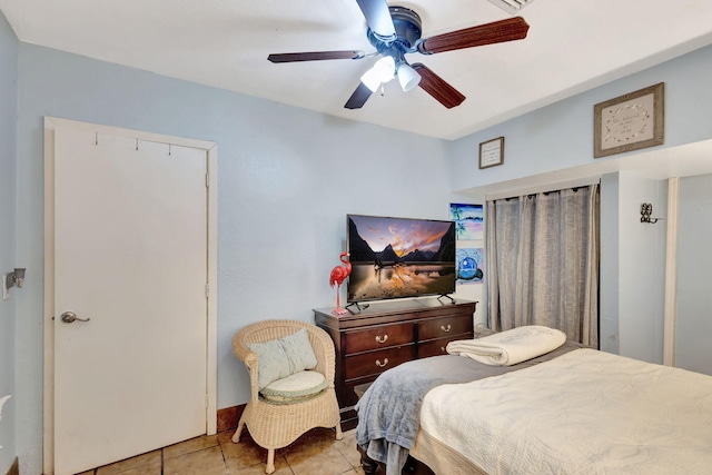 bedroom with light tile patterned floors and ceiling fan