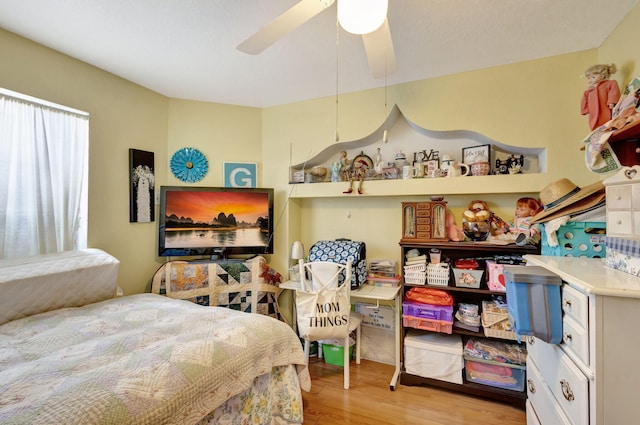 bedroom featuring ceiling fan and light hardwood / wood-style floors