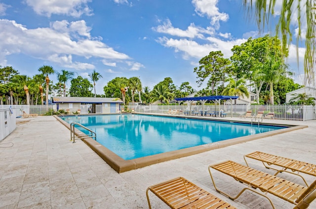 view of swimming pool featuring a patio