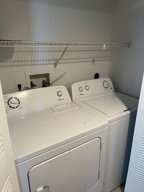 clothes washing area featuring washing machine and dryer