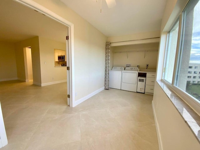 laundry room featuring ceiling fan and washing machine and clothes dryer