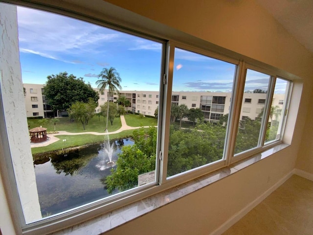 unfurnished sunroom with a water view