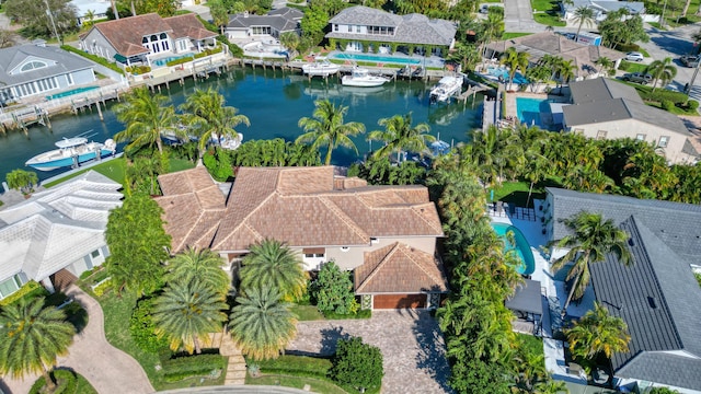 birds eye view of property featuring a residential view and a water view