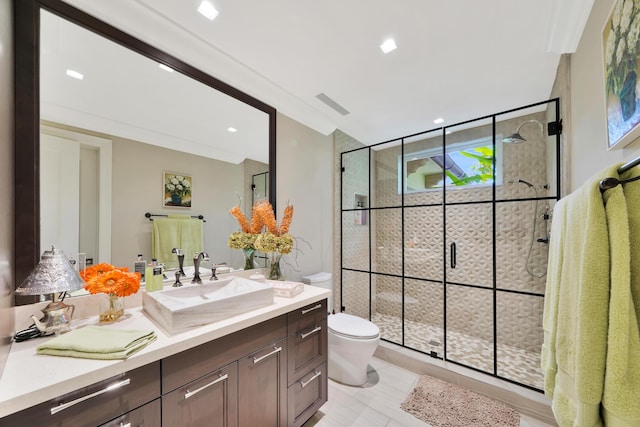 bathroom featuring tile patterned flooring, vanity, an enclosed shower, and toilet