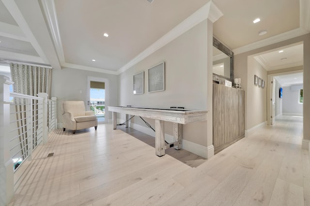 corridor featuring light hardwood / wood-style floors and crown molding