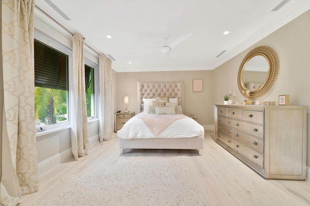 bedroom with crown molding, ceiling fan, and light wood-type flooring