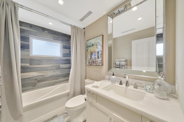 full bathroom featuring vanity, toilet, and shower / bath combo with shower curtain