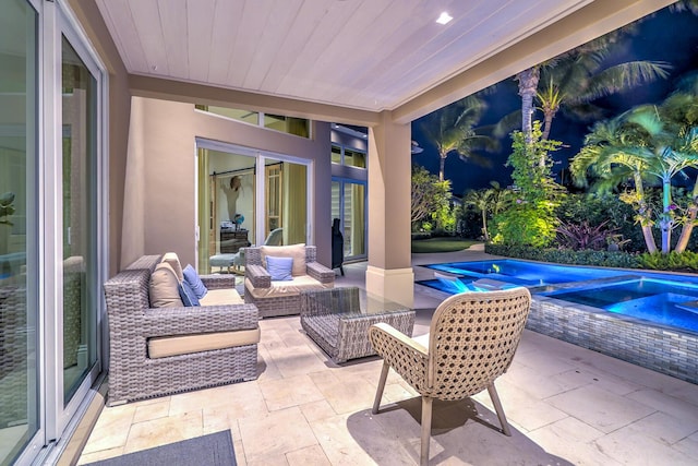 view of patio / terrace with outdoor lounge area and a swimming pool with hot tub