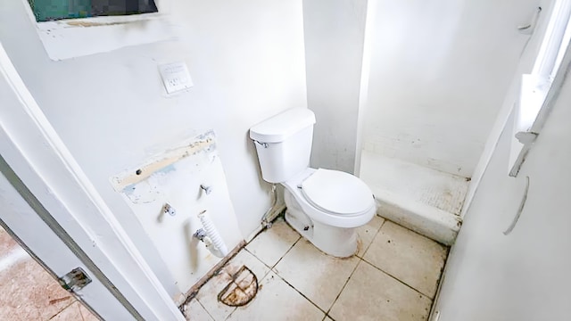 bathroom featuring tile patterned flooring and toilet