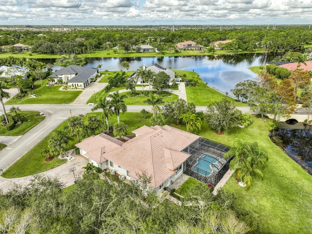 birds eye view of property with a water view