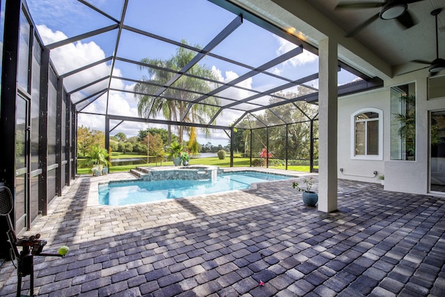 view of pool featuring ceiling fan, glass enclosure, a patio, and a pool with connected hot tub