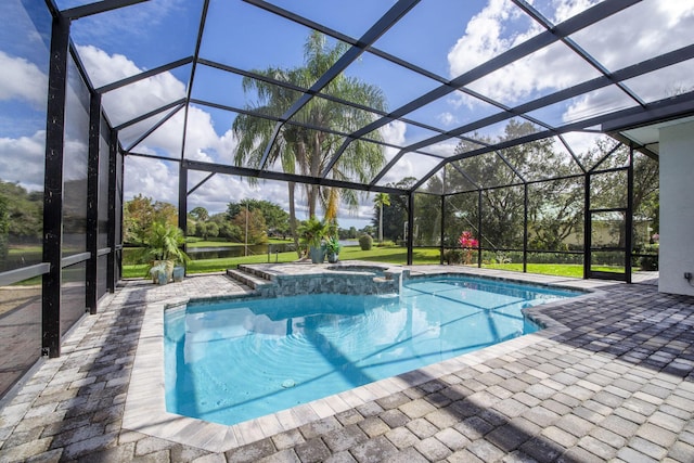 view of pool with an in ground hot tub, a patio, and glass enclosure