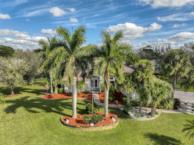 view of property's community with a yard