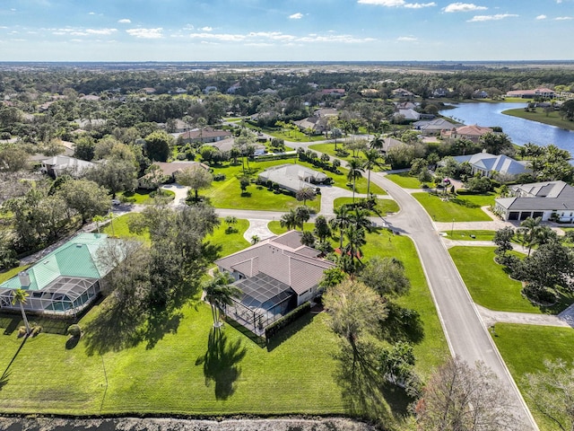 bird's eye view featuring a water view and a residential view