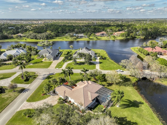 drone / aerial view with a water view and a residential view