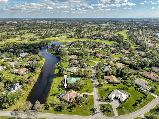 drone / aerial view featuring a water view and a residential view