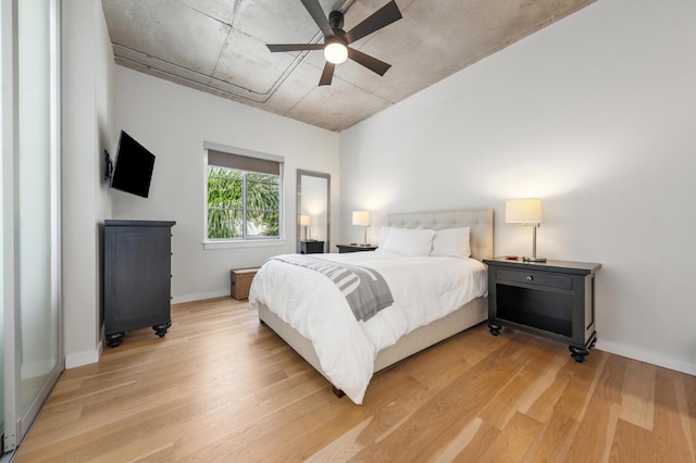 bedroom with ceiling fan and light hardwood / wood-style flooring