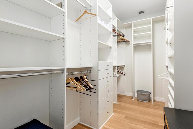 spacious closet featuring hardwood / wood-style floors